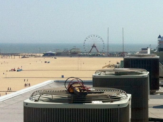 Rooftop air conditioners above the Ocean City boardwalk with the ferris wheel in the background