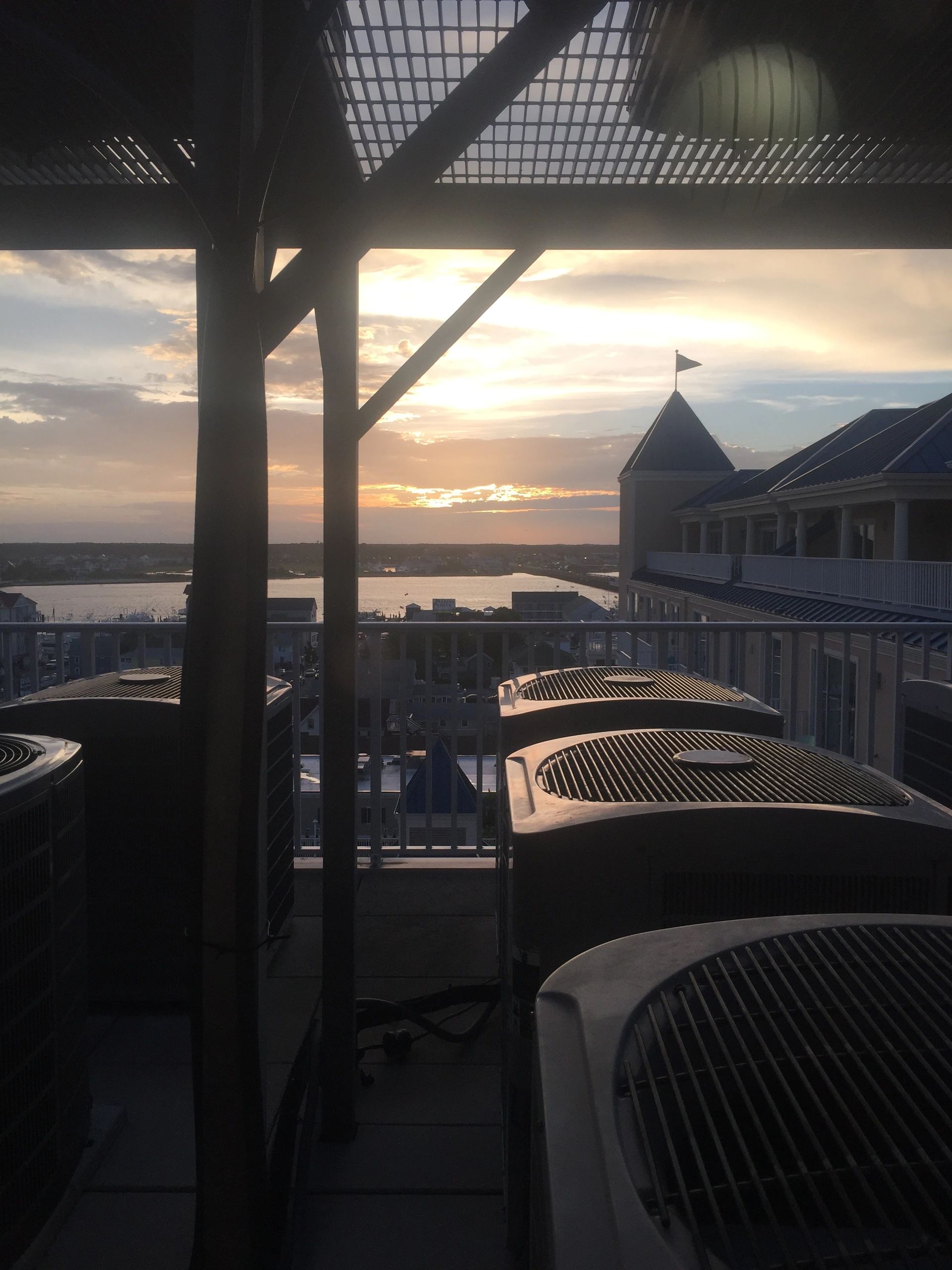Rooftop heat pumps overlooking the Ocean City bay at sunset