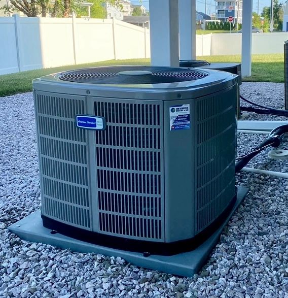 American Standard heat pump installed by Jim Schiffler on a level composite pad