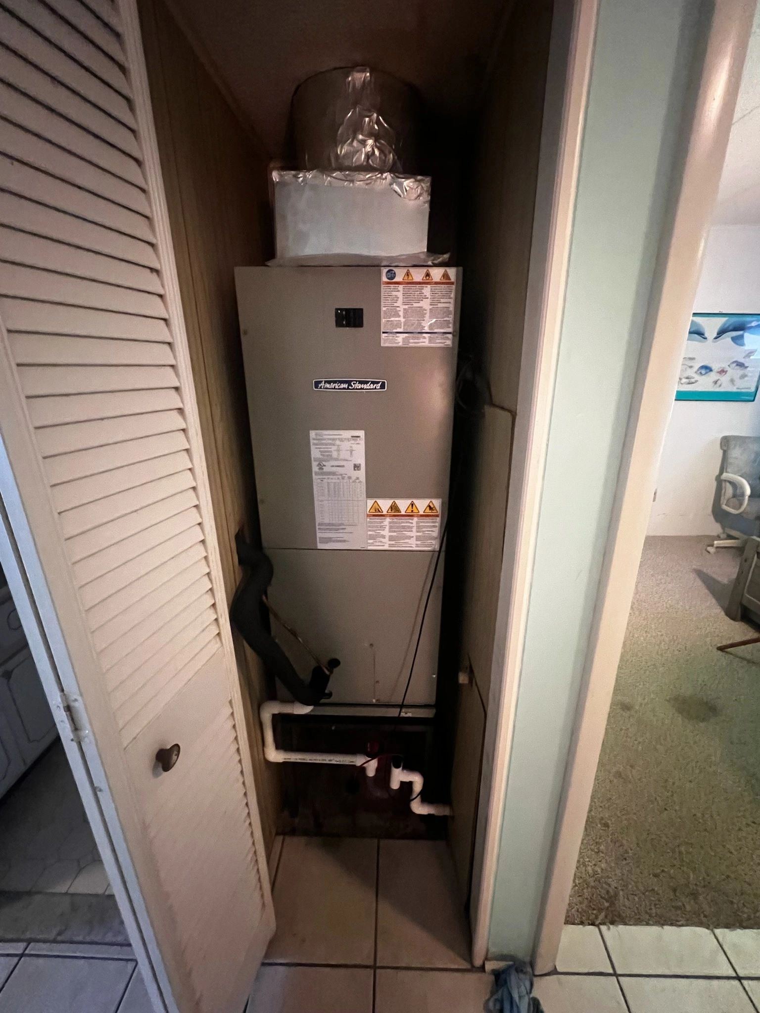 New American Standard air handler installed in a utility closet